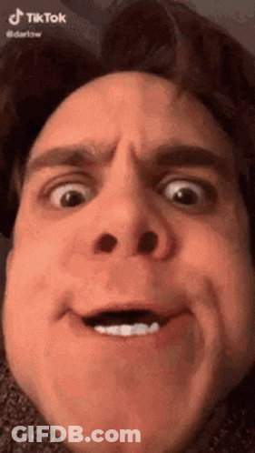 A Close Up Of A Man 'S Face With A Funny Face . GIF