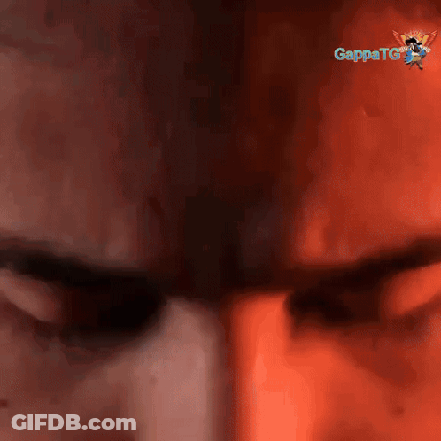 A Close Up Of A Man 'S Face With A Gappatg Logo In The Background GIF