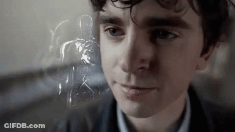 A Close Up Of A Man 'S Face With A Ghost In The Background Behind Him . GIF