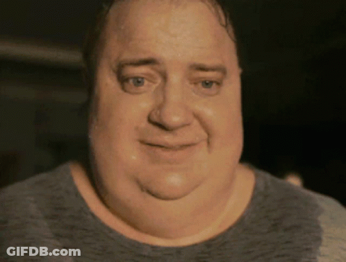 A Close Up Of A Man 'S Face With A Gray Shirt GIF