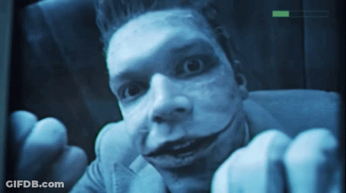 A Close Up Of A Man 'S Face With A Green Arrow Pointing To The Right GIF