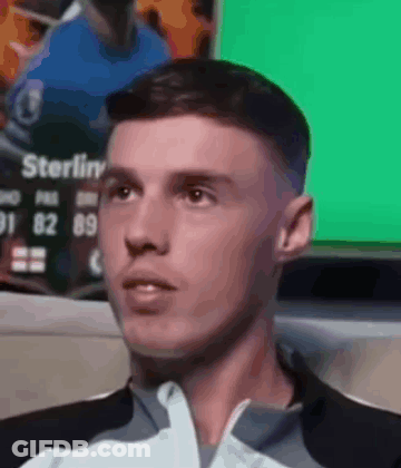 A Close Up Of A Man 'S Face With A Green Background GIF