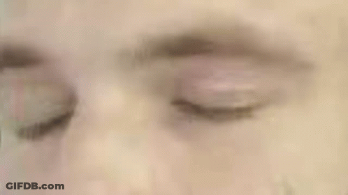 A Close Up Of A Man 'S Face With A Green Circle Around His Head GIF
