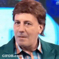 A Close Up Of A Man 'S Face With A Green Jacket On GIF