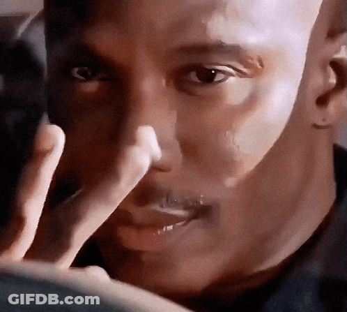 A Close Up Of A Man 'S Face With A Hand Covering His Nose GIF