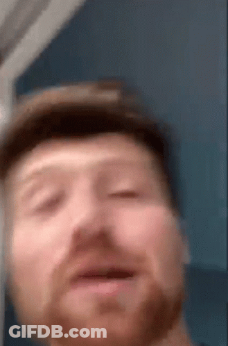 A Close Up Of A Man 'S Face With A Hat On GIF