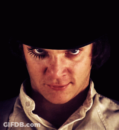A Close Up Of A Man 'S Face With A Hat On GIF
