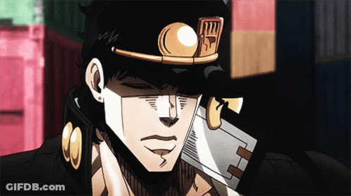 A Close Up Of A Man 'S Face With A Hat That Says ' Jojo ' On It GIF