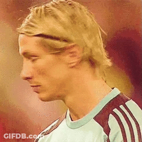 A Close Up Of A Man 'S Face With A Headband On His Head . GIF