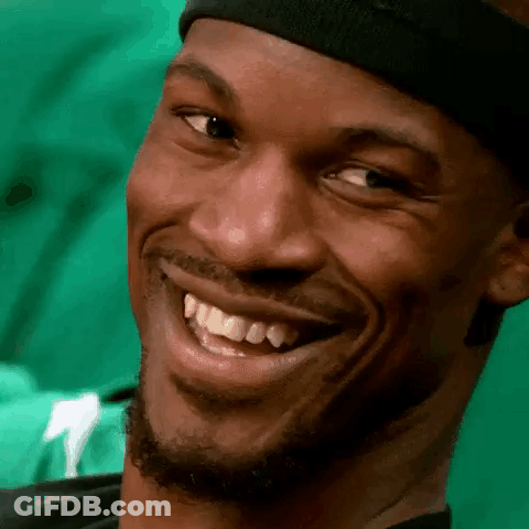 A Close Up Of A Man 'S Face With A Headband On Smiling . GIF