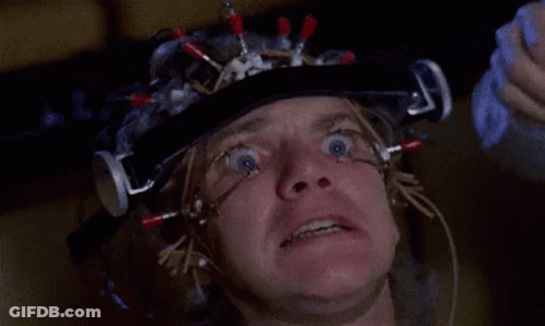 A Close Up Of A Man 'S Face With A Helmet On His Head . GIF