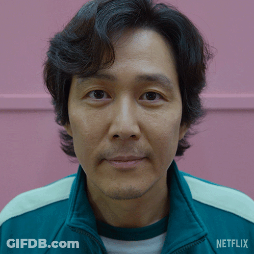 A Close Up Of A Man 'S Face With A Jacket That Says Netflix On It GIF