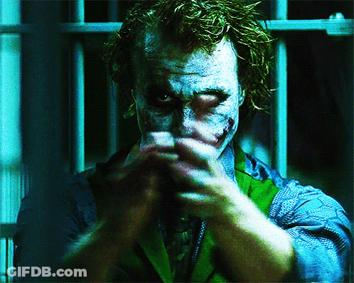 A Close Up Of A Man 'S Face With A Joker Face Paint GIF