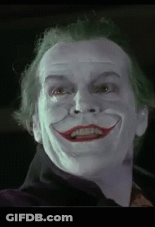 A Close Up Of A Man 'S Face With A Joker 'S Face Painted On It . GIF