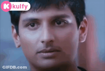 A Close Up Of A Man 'S Face With A K Kulfy Logo Behind Him GIF
