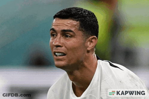 A Close Up Of A Man 'S Face With A Kapwing Logo Behind Him GIF
