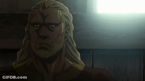A Close Up Of A Man 'S Face With A Light Behind Him GIF