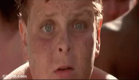 A Close Up Of A Man 'S Face With A Lot Of Freckles On It . GIF