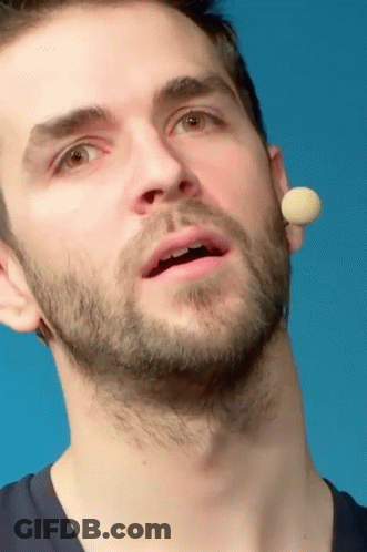A Close Up Of A Man 'S Face With A Microphone Behind His Ear GIF