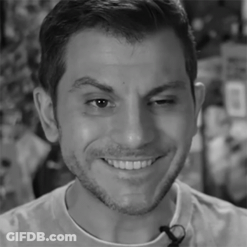 A Close Up Of A Man 'S Face With A Microphone On His Neck GIF