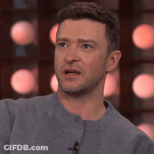 A Close Up Of A Man 'S Face With A Microphone On It GIF