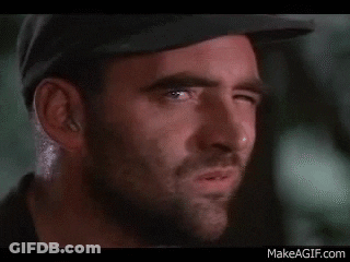 A Close Up Of A Man 'S Face With A Missing Tooth . GIF