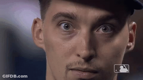 A Close Up Of A Man 'S Face With A MLB Logo On The Bottom GIF