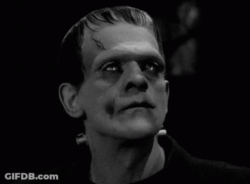 A Close Up Of A Man 'S Face With A Monster 'S Head . GIF
