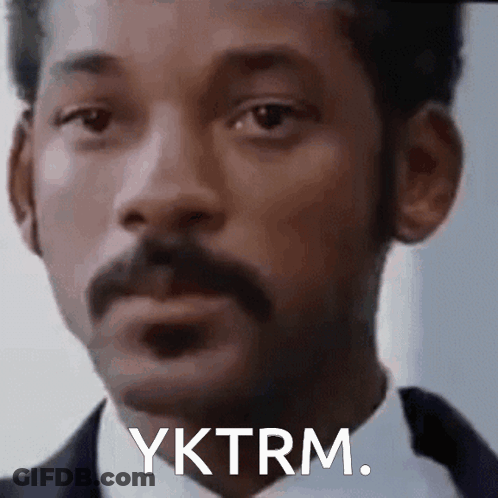 A Close Up Of A Man 'S Face With A Mustache And The Words Yktrm . GIF