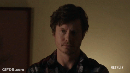A Close Up Of A Man 'S Face With A Netflix Advertisement In The Corner GIF