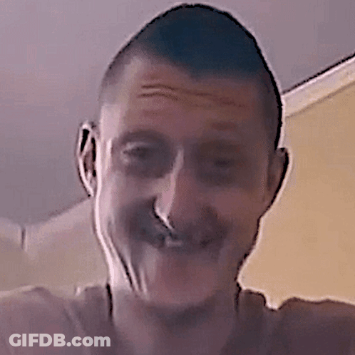A Close Up Of A Man 'S Face With A Nose Ring On It GIF
