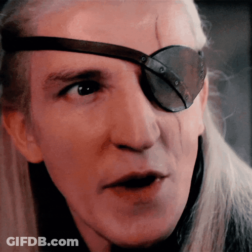 A Close Up Of A Man 'S Face With A Patch On His Eye GIF