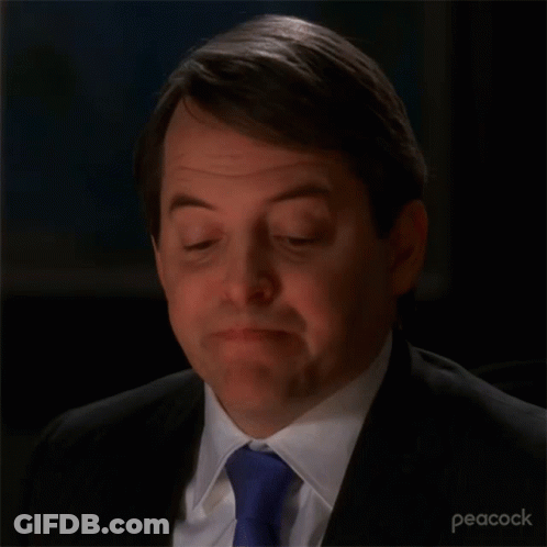 A Close Up Of A Man 'S Face With A Peacock Logo In The Corner GIF