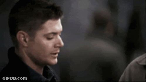 A Close Up Of A Man 'S Face With A Person Touching His Shoulder GIF