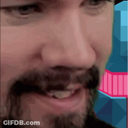 A Close Up Of A Man 'S Face With A Pink And Blue Background GIF