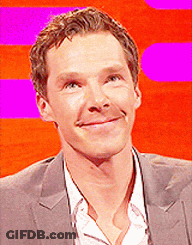 A Close Up Of A Man 'S Face With A Pink Background GIF