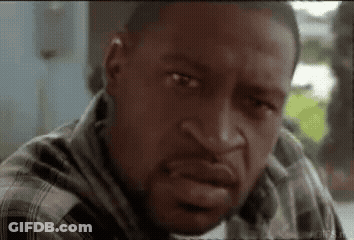 A Close Up Of A Man 'S Face With A Plaid Shirt On GIF