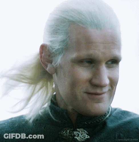 A Close Up Of A Man 'S Face With A Ponytail And The Words Coparolight Tumblr Below Him GIF
