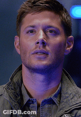 A Close Up Of A Man 'S Face With A Purple Background GIF