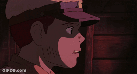 A Close Up Of A Man 'S Face With A Purple Hat On GIF
