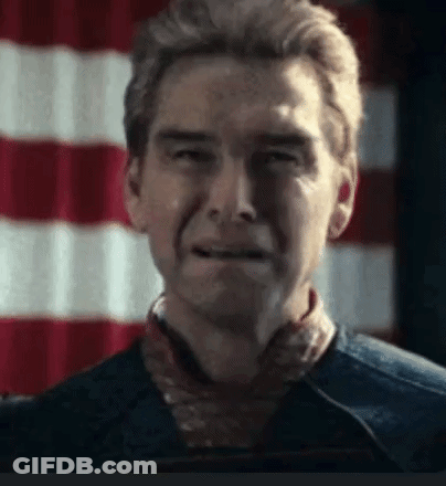 A Close Up Of A Man 'S Face With A Red And White Flag In The Background . GIF