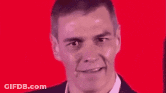 A Close Up Of A Man 'S Face With A Red Background And A Smile On His Face . GIF