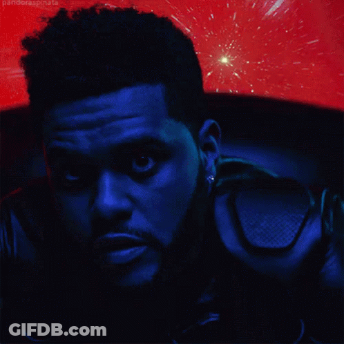 A Close Up Of A Man 'S Face With A Red Background Behind Him GIF