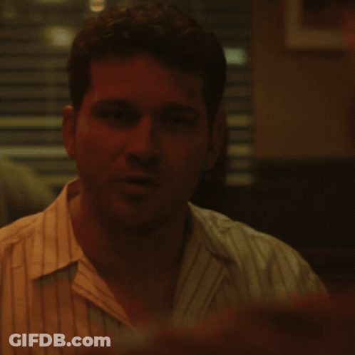 A Close Up Of A Man 'S Face With A Red Background GIF
