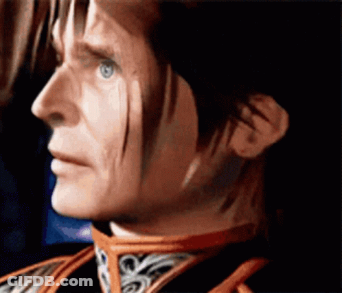 A Close Up Of A Man 'S Face With A Red Collar GIF
