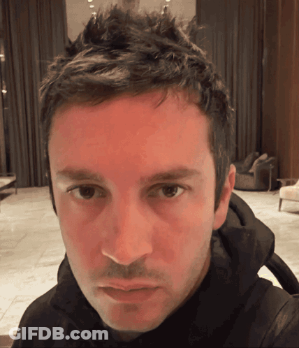 A Close Up Of A Man 'S Face With A Red Face GIF
