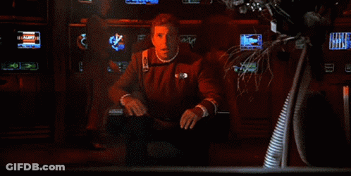 A Close Up Of A Man 'S Face With A Red Light Behind Him GIF