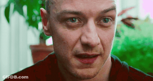 A Close Up Of A Man 'S Face With A Red Shirt On GIF
