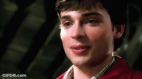 A Close Up Of A Man 'S Face With A Red Shirt GIF