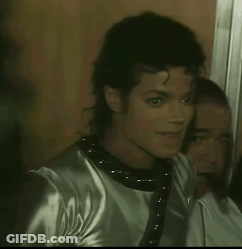 A Close Up Of A Man 'S Face With A Reflection In The Mirror GIF